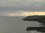 SX00542 Sunrays through clouds on sea and metal man.jpg